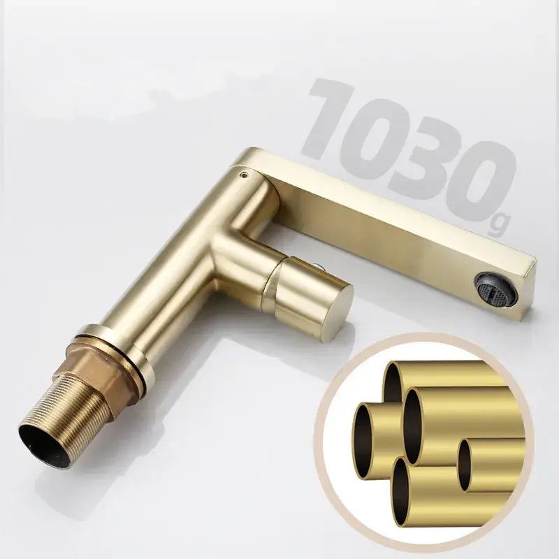 Brass-finished modern brushed gold basin faucet with sleek angular design and matching rectangular deck plate by decorbites