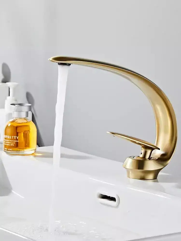 Modern brushed gold basin faucet with sleek curved design, decorbites brushed gold finish for stylish bathroom sink fixture