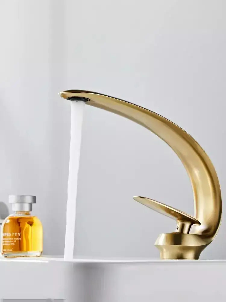 Modern brushed gold basin faucet with sleek curved design in brushed gold finish decorbites brushed gold fixture