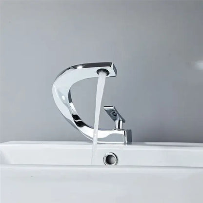 Modern chrome finished basin faucet with sleek curved design and single handle by decorbites basin faucet collection