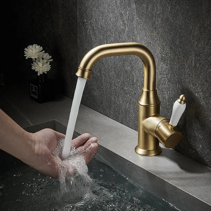 Modern brushed gold basin faucet with brass finish and white ceramic handle by decorbites for bathroom sink use