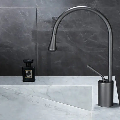 Modern matte black basin faucet with sleek curved spout and cylindrical base in decorbites brushed gold bathroom style