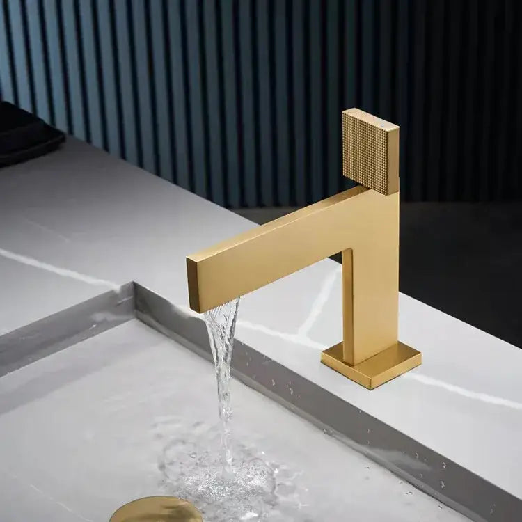 Modern brushed gold basin faucet with textured square handle and sleek geometric design by decorbites brushed gold