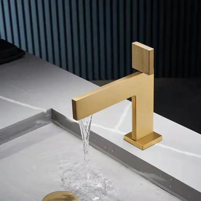 Modern brushed gold basin faucet with textured square handle and sleek geometric design by decorbites brushed gold