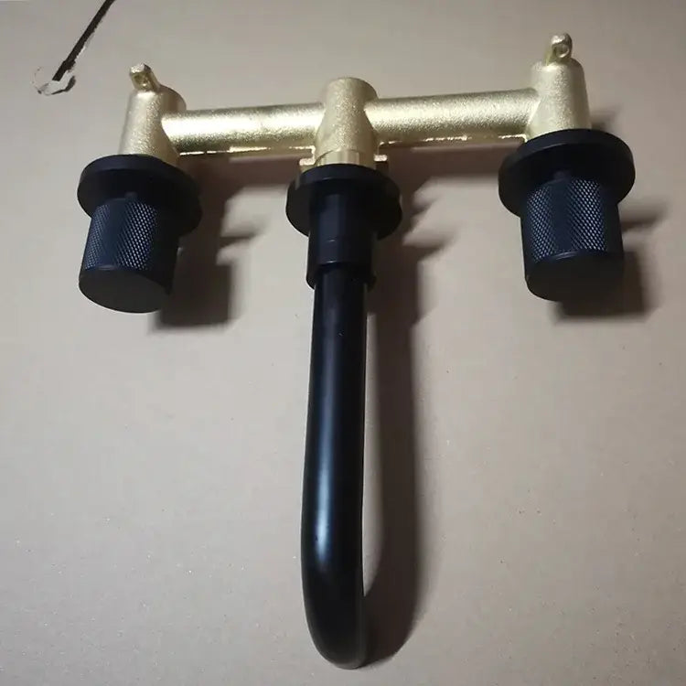 Modern brushed gold basin faucet with black textured knobs and curved spout by decorbites brushed gold wall mount brass mixer tap