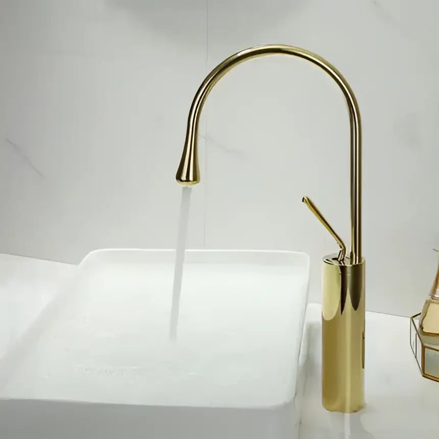 Modern brushed gold basin faucet with sleek curved spout and cylindrical base by decorbites for kitchen use