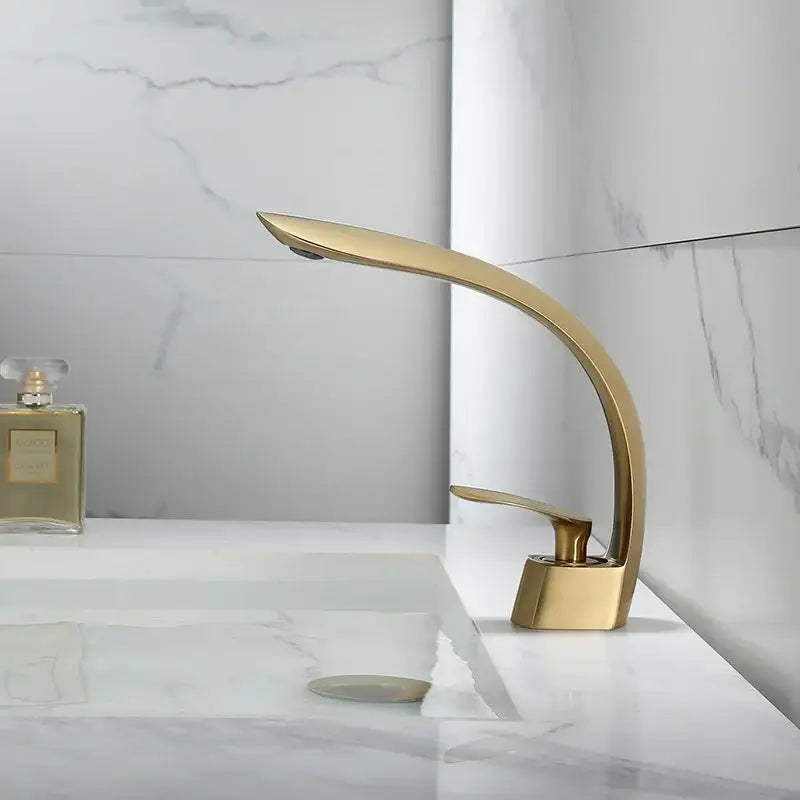 Modern brushed gold basin faucet with sleek curved design in decorbites brushed gold finish for bathroom use