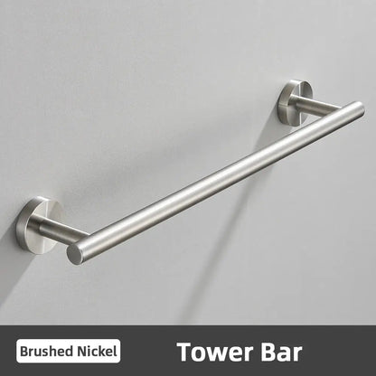 Brushed nickel tower bar with sleek cylindrical design and polished metal finish in modern brushed gold bathroom accessories set