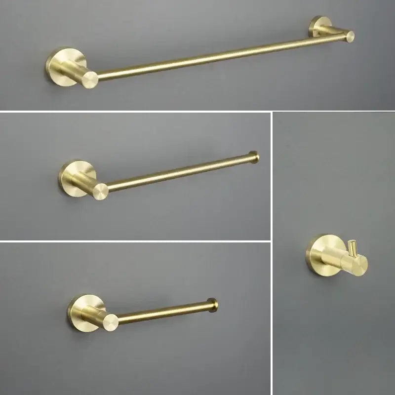 Brushed gold wall-mounted towel rack with circular mounting plates in modern bathroom hardware set