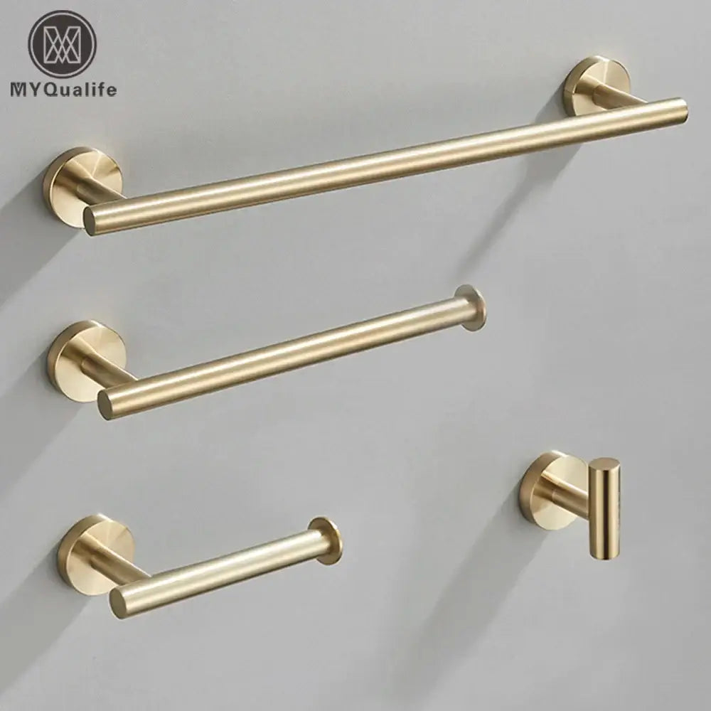 Modern brushed gold bathroom hardware set featuring a gold-toned brushed metal towel rack with matching hooks and mounts
