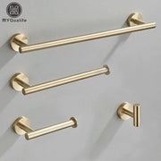 Modern brushed gold bathroom hardware set featuring a gold-toned brushed metal towel rack with matching hooks and mounts