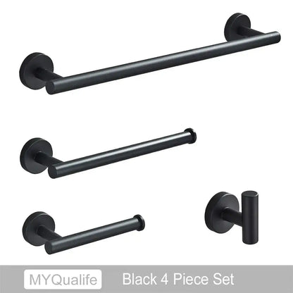 Black matte bathroom hardware set with towel bar and toilet paper holder complementing decorbites brushed gold style
