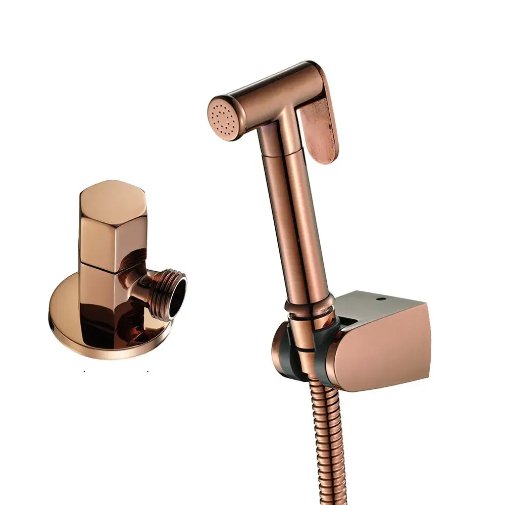 Modern brushed gold bidet sprayer kit with copper-finished nozzle and flexible hose for bathroom use