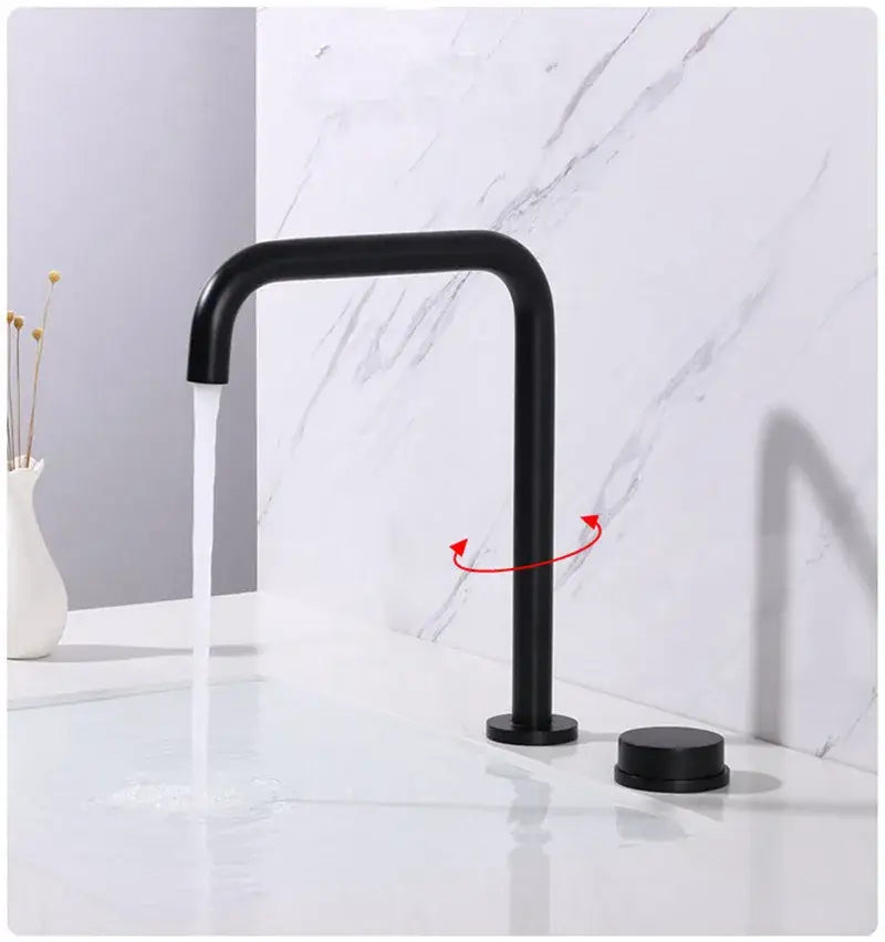 Modern brushed gold and black basin faucet with black matte finish curved spout and two cylindrical handles decorbites brushed gold
