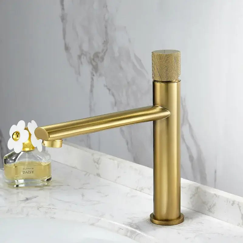 Modern brushed gold brass basin faucet with knurled handle and sleek minimalist design for bathroom sink use