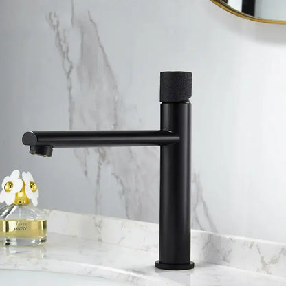 Modern brushed gold brass basin faucet with black matte single-handle and textured cylindrical knob for bathroom use