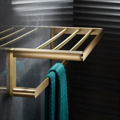 Modern brushed gold brass bath hardware set towel rack with sleek horizontal bars in a bath hardware set design