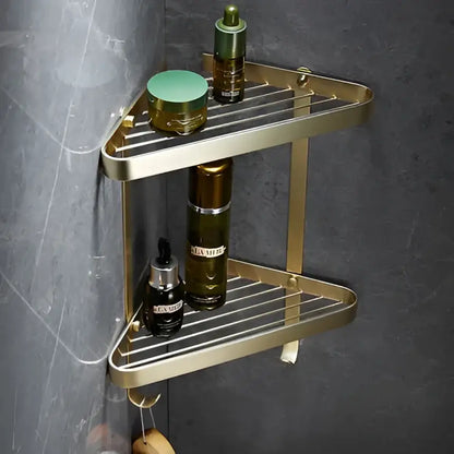 Modern brushed gold brass bath hardware set featuring a gold-toned triangular corner shower caddy with two tiers