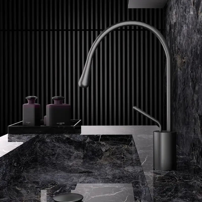 Modern brushed gold brass kitchen faucet with matte black finish, sleek curved spout, and cylindrical base for sink use