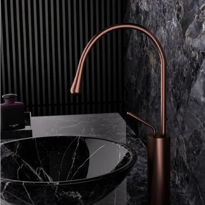 Modern brushed gold brass kitchen faucet with copper finish, sleek curved spout, and cylindrical base for sink use