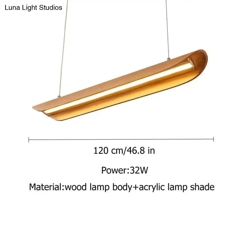 A modern brushed gold kitchen island light with a sleek elongated design perfect for chandeliers kitchen island use