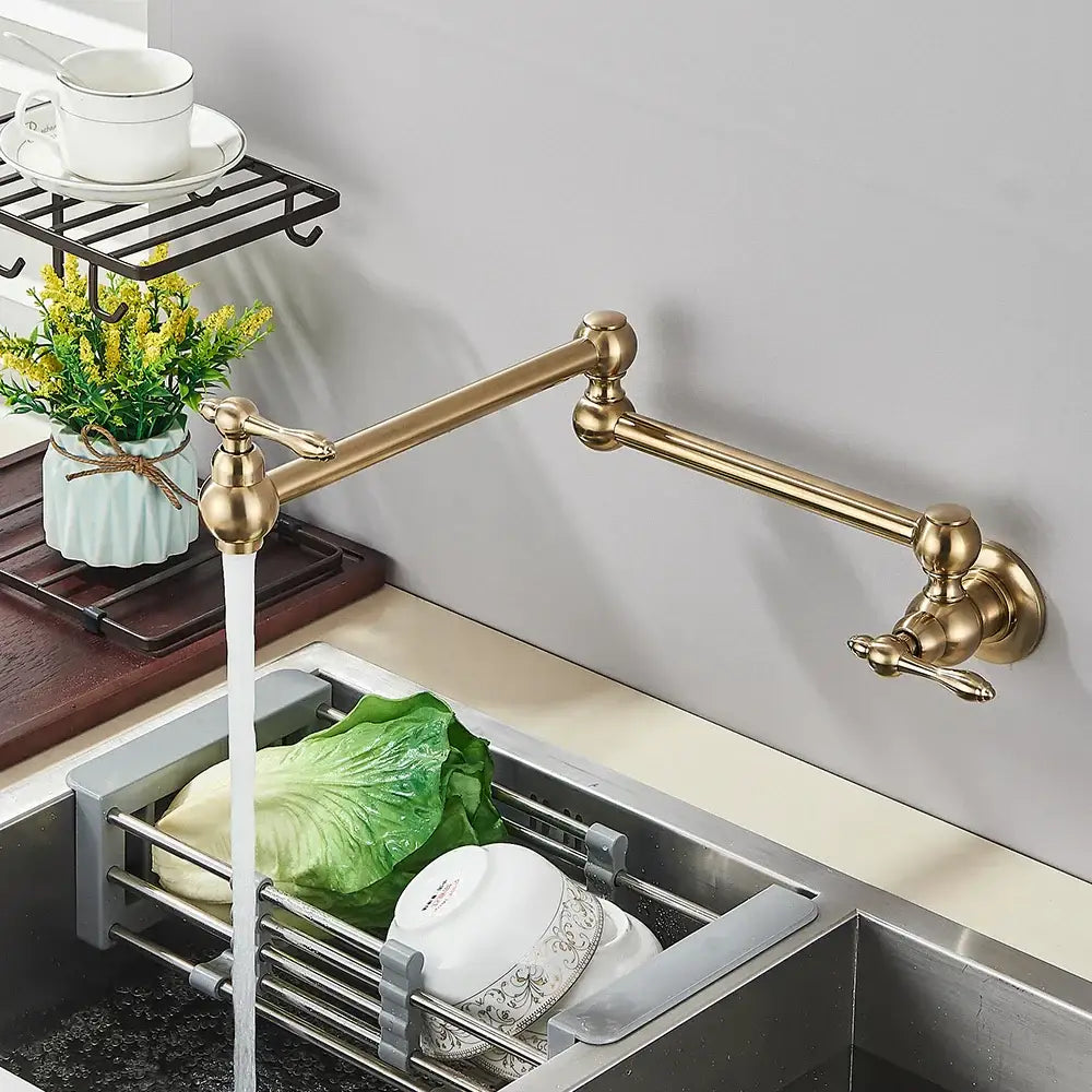 Brass-finished wall-mounted modern brushed gold pot filler faucet with gooseneck spout and pull-out spray head