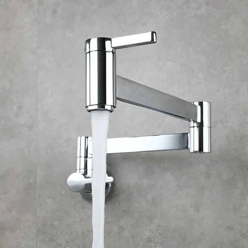 Modern brushed gold pot filler faucet with chrome finish and articulated foldable spout flowing white water stream