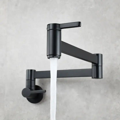 Black matte wall-mounted pot filler faucet with sleek articulated arm and dual handles for modern kitchen use