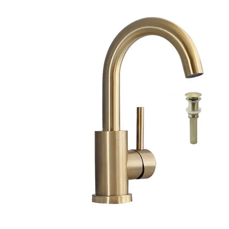 Modern brushed gold single handle basin faucet with brass finish and sleek curved spout including matching drain assembly