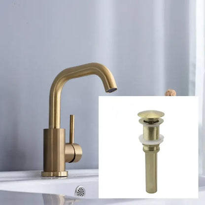 Modern brushed gold single handle basin faucet with brass finish, sleek curved spout, and matching drain assembly for bathroom use