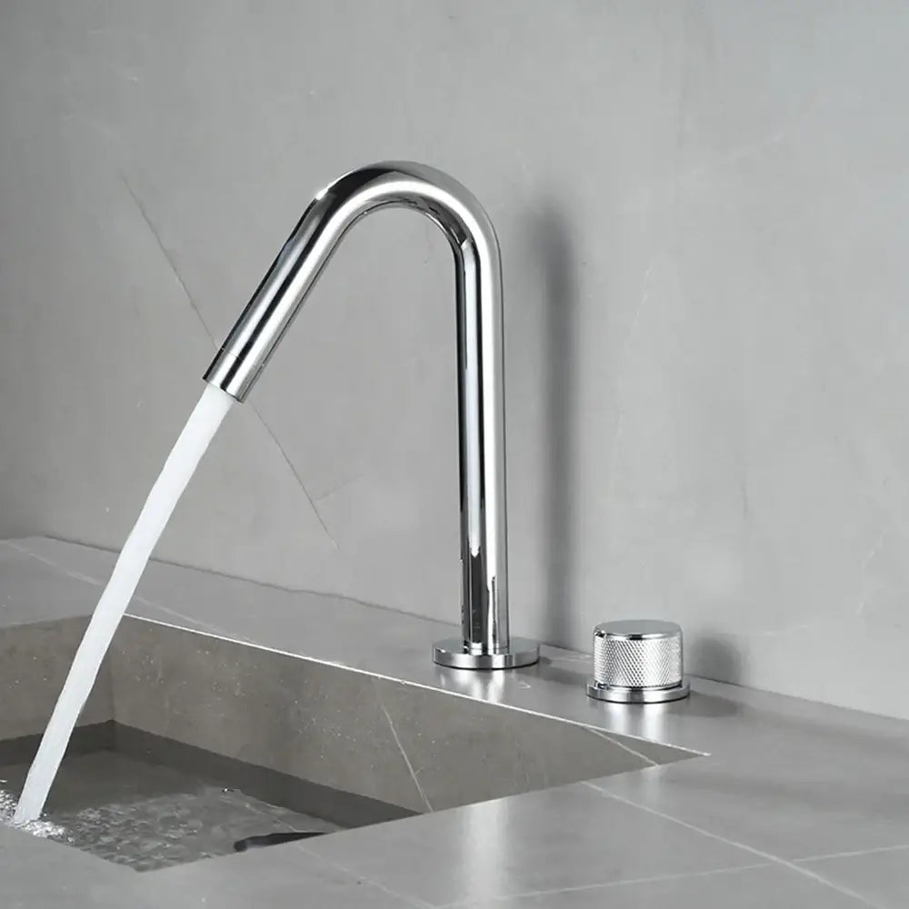 Modern chrome-finished single-handle kitchen faucet with sleek curved spout and textured knob for premium ceramic valve use