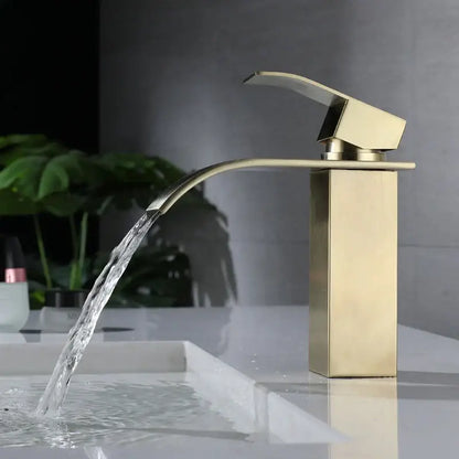 Modern brushed gold stainless steel basin faucet with sleek waterfall spout and rectangular minimalist base design