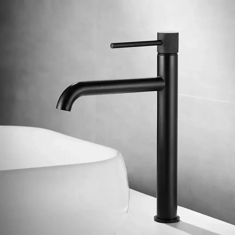 Modern brushed gold swivel faucet with black matte finish textured knob and minimalist design for bathroom basin sink