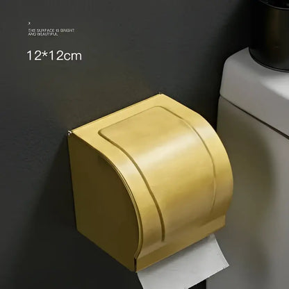 Modern brushed gold toilet paper holder with sleek curved lid and minimalist finish for bathroom paper holder use