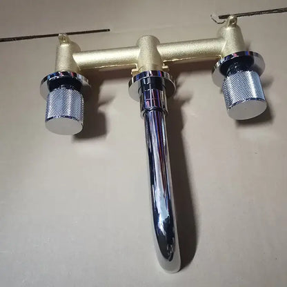 Modern brushed gold double-handle bathroom faucet with chrome spout and textured silver knobs for wall mount use