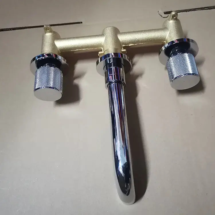Modern brushed gold double-handle bathroom faucet with chrome spout and textured silver knobs for wall mount use