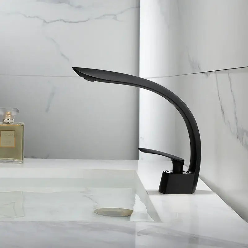 Black matte basin faucet with sleek curved design complementing decorbites brushed gold basin bathroom mixer tap