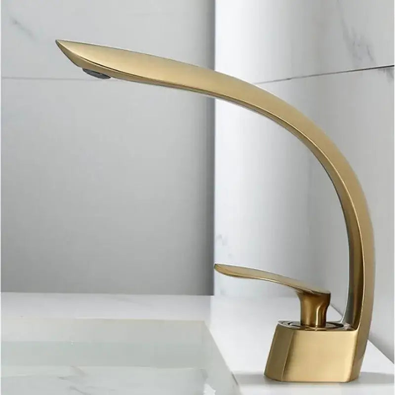 Modern brushed gold waterfall basin faucet with sleek curved design and polished decorbites brushed gold finish