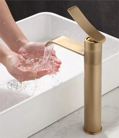 Modern brushed gold basin mixer with a sleek tall cylindrical body for decorbites bronze bathroom sink use