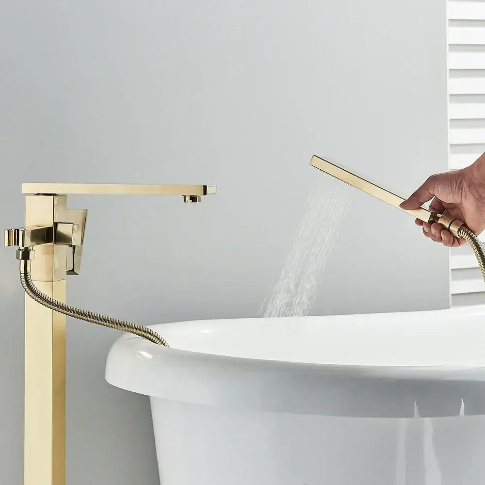 Modern brushed gold waterfall tub faucet with sleek rectangular spout and matching handheld shower decorbites brushed gold