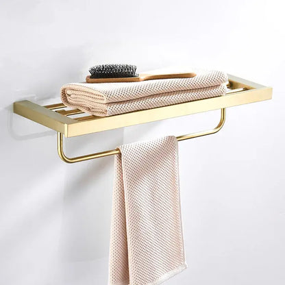 Modern brushed matt gold decorbites bath set metal bathroom rack with flat shelf and towel bar holding beige towels and brush
