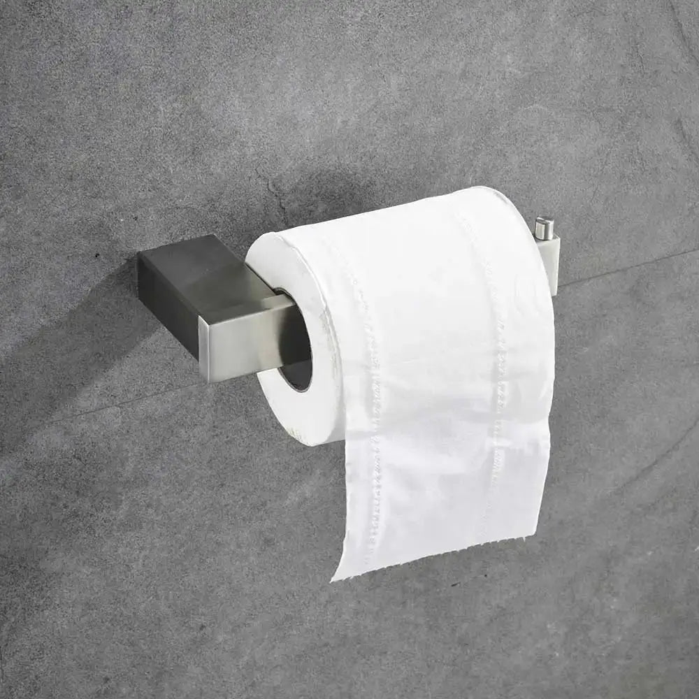 Modern brushed stainless steel toilet paper holder with sleek rectangular design in a bathroom hardware set