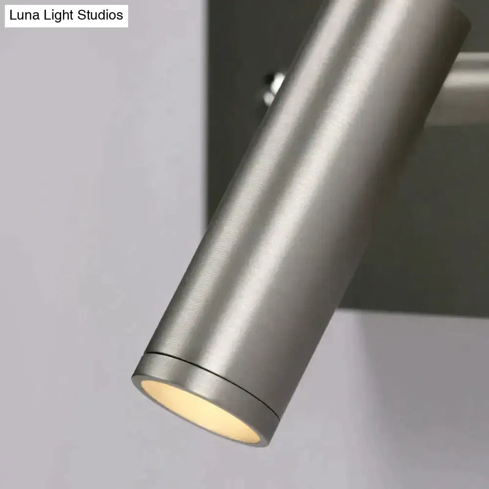 Modern brushed nickel led dimmable reading wall light with a cylindrical brushed metallic finish and warm diffused lighting