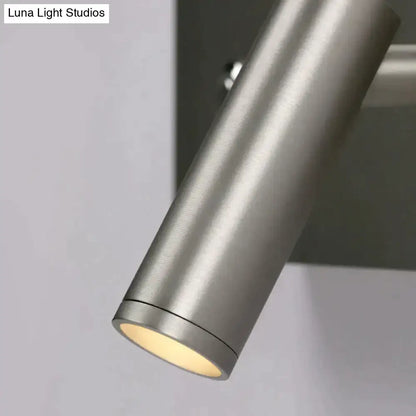 Modern brushed nickel led dimmable reading wall light with a cylindrical brushed metallic finish and warm diffused lighting