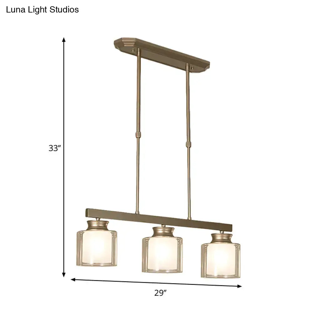Bronze-finished three-light pendant fixture with clear glass shade from DecorBites traditional gold island lamp
