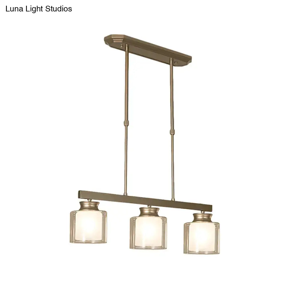 DecorBites traditional gold three-light pendant fixture with bronze finish and clear glass shade ideal for dining rooms