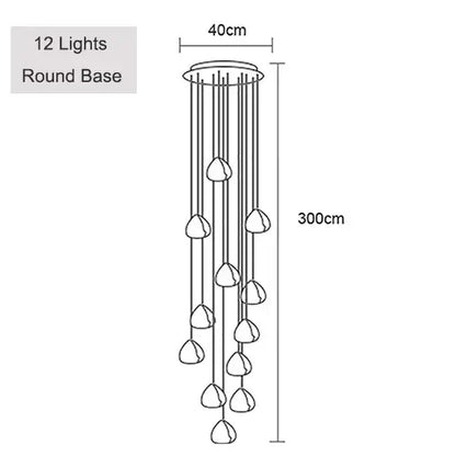Modern brushed stainless steel pendant light with twelve teardrop glass fixtures and round base for staircase lighting