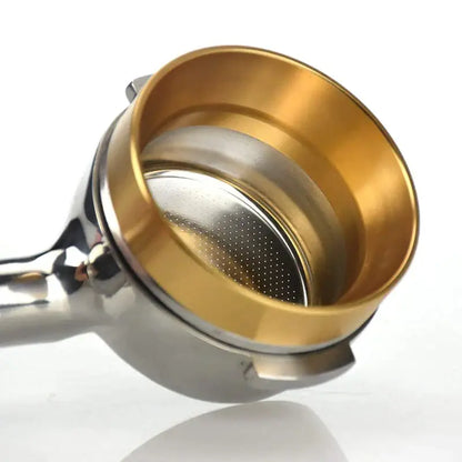 Modern brushed stainless steel espresso dosing ring with gold-finished portafilter basket and perforated filter insert