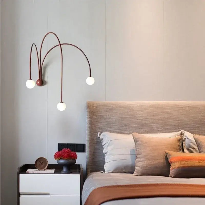 Modern burgundy iron glass led wall light with copper-toned sconce and three curved arms for living room decorbites iron glass
