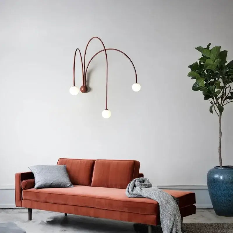 Modern burgundy iron glass led wall light with copper-toned sconce and three curved arms for living room decorbites iron glass